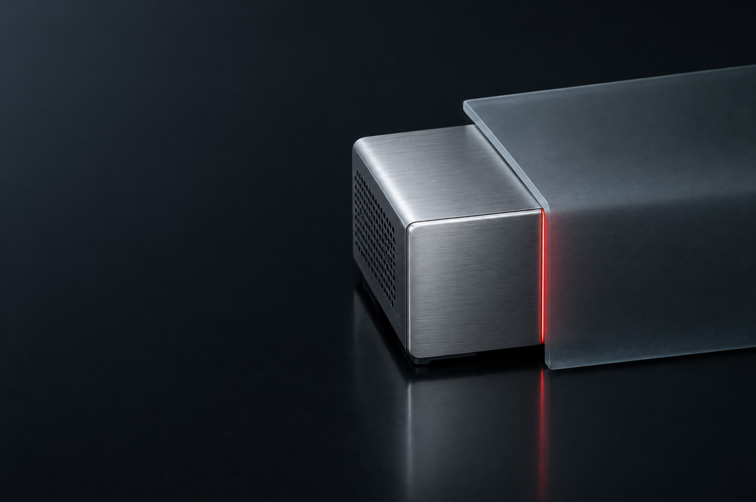 Brushed aluminium server module with a thin red seam, half covered by frosted glass